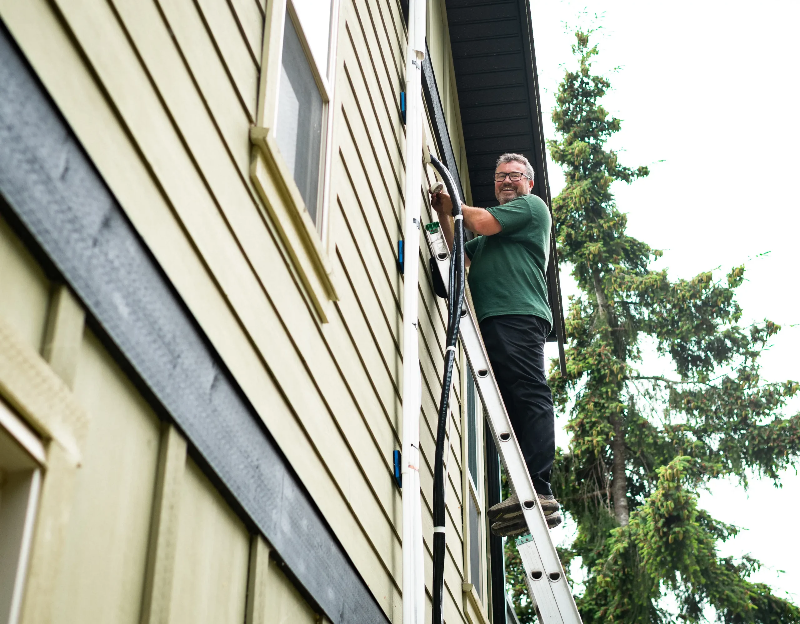 Sasquatch technician performing a Moovair heat pump start-up on Vancouver Island